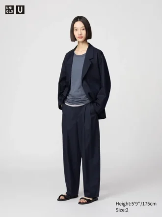 Pantaloni larghi a pieghe in cotone e lyocell da donna
